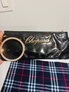 Chopard Black Patent Wristlet Clutch with Gold Logo Ring